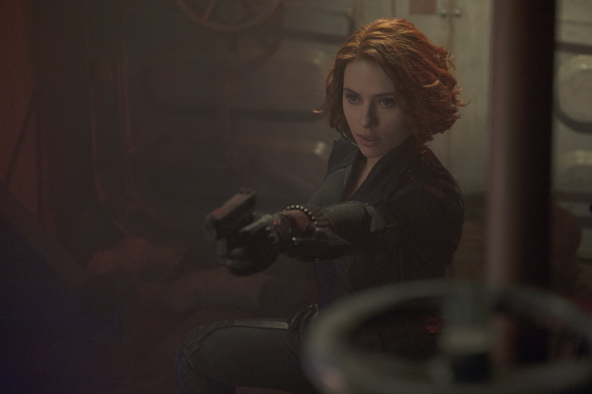 Scarlett Johansson as Black Widow in a dramatic scene from Avengers: Age of Ultron, showcasing her fierce determination in a visually striking 4K Ultra HD wallpaper.