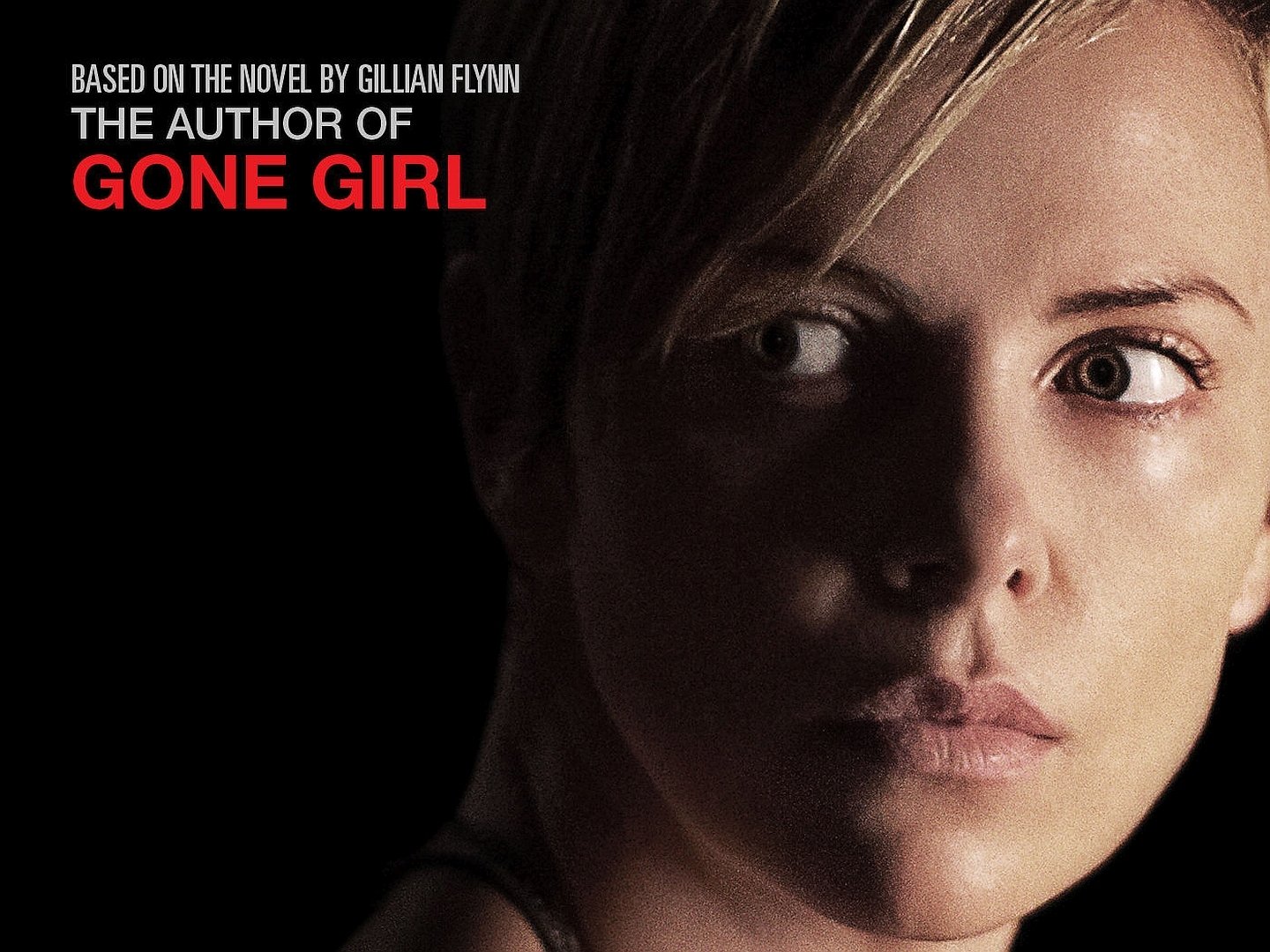 HD PC desktop wallpaper featuring Charlize Theron from the movie Dark Places, highlighting a close-up of her face with dramatic lighting and bold text referencing Gone Girl.
