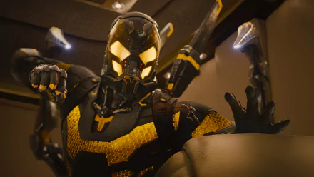 8K Ultra HD PC desktop wallpaper of Ant-Man in his black and yellow suit, poised for action in a dynamic movie-inspired scene.