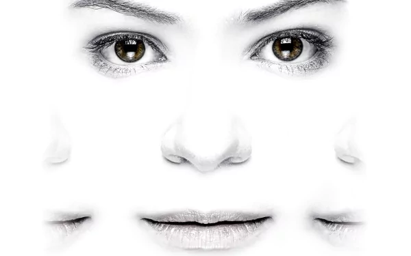 Close-up of multiple faces blending into a white background, representing the TV show Orphan Black, presented as a 4K Ultra HD PC desktop wallpaper and background.