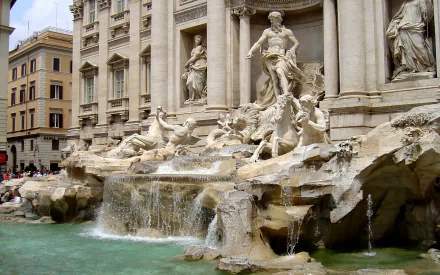 HD desktop wallpaper showcasing the intricate man-made sculptures of Rome's iconic Trevi Fountain in Italy.