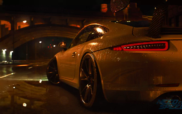 A sleek white sports car gleams in the rain-soaked streets, illuminated by city lights, capturing the thrilling essence of Need For Speed (2015) in this HD desktop wallpaper.