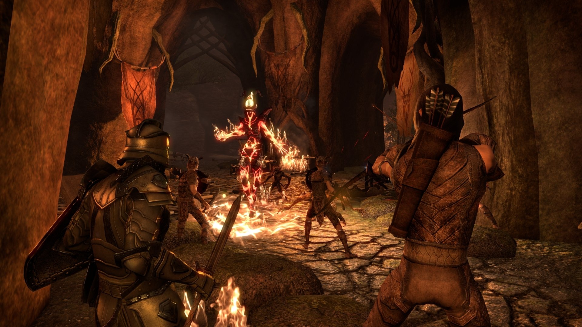Video game HD PC desktop wallpaper: The Elder Scrolls Online — armored adventurers clash with a flaming Daedra amid a torchlit dungeon.
