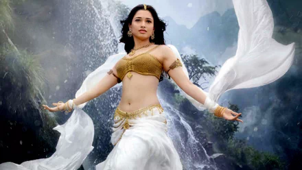 HD PC desktop wallpaper featuring a scene from the movie Baahubali: The Beginning, showcasing the character in traditional attire against a waterfall backdrop.