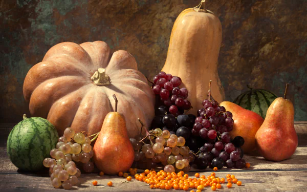 A 4K Ultra HD still life desktop wallpaper showcasing a fall harvest with pears, grapes, pumpkins, and small watermelons arranged on a wooden surface.