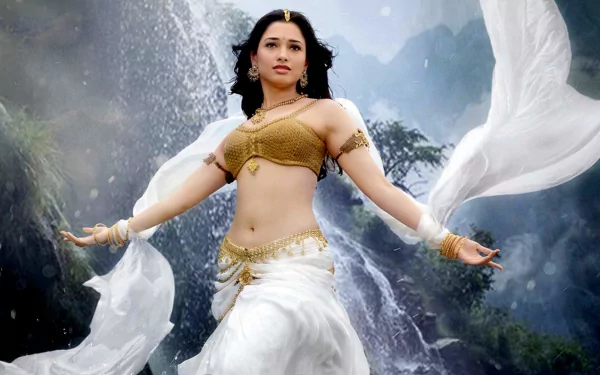 HD PC desktop wallpaper featuring a scene from the movie Baahubali: The Beginning, showcasing the character in traditional attire against a waterfall backdrop.