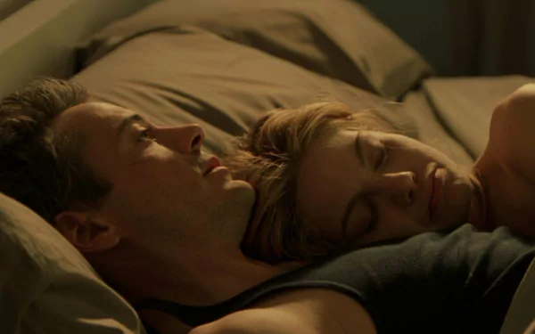 HD PC wallpaper: intimate bedside shot of two characters asleep together in a dimly lit scene from the movie Kiss Kiss Bang Bang.