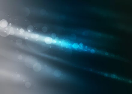 Abstract HD PC desktop wallpaper featuring soft, glowing blue and white light streaks and bokeh effects against a dark background.