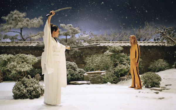 Uma Thurman and Lucy Liu face off in a dramatic snowy scene from Kill Bill: Vol. 1. This 4K Ultra HD wallpaper captures the intensity of the iconic film.