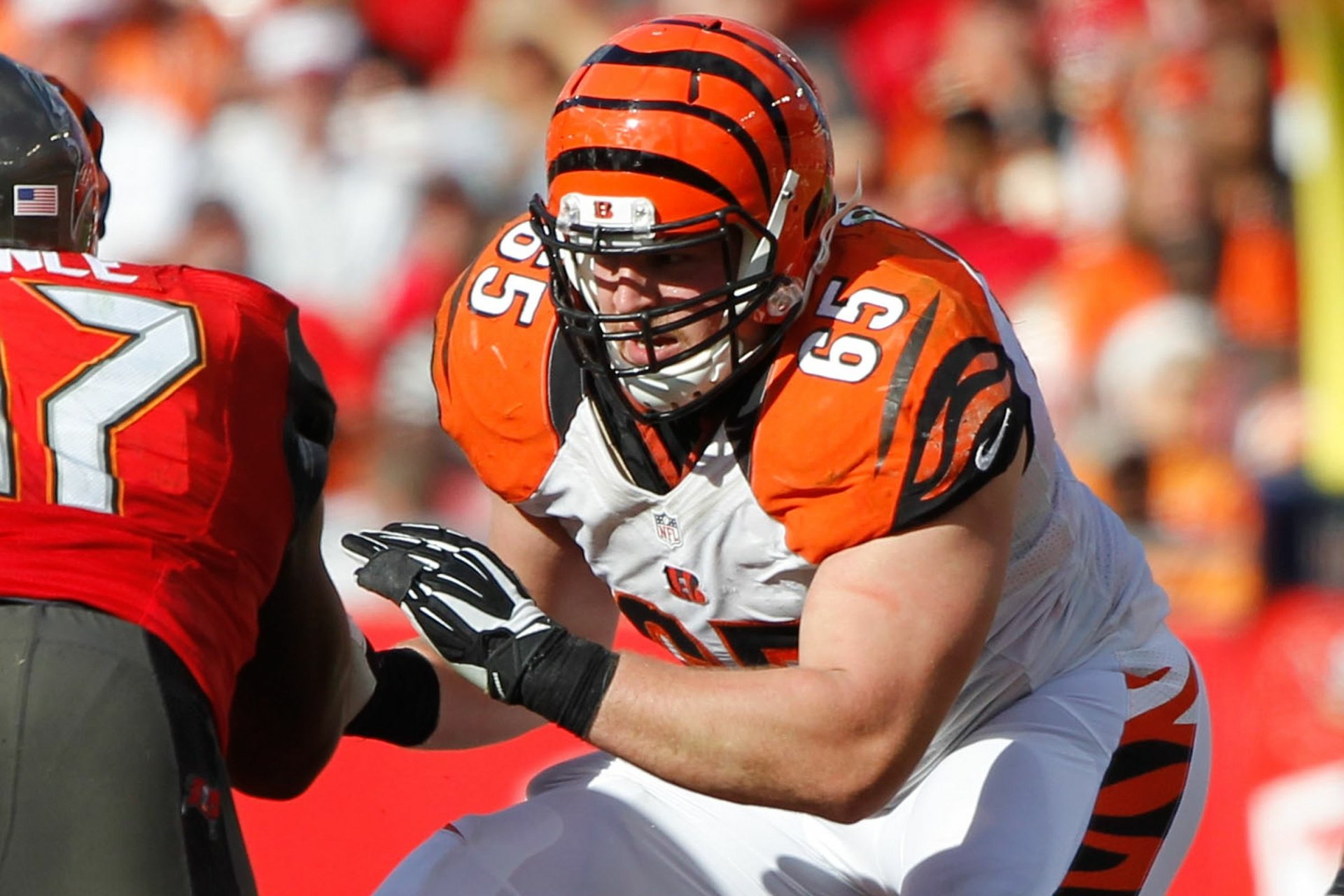 HD PC desktop wallpaper featuring a Cincinnati Bengals player in action during a football game, showcasing the team's orange and black uniform.