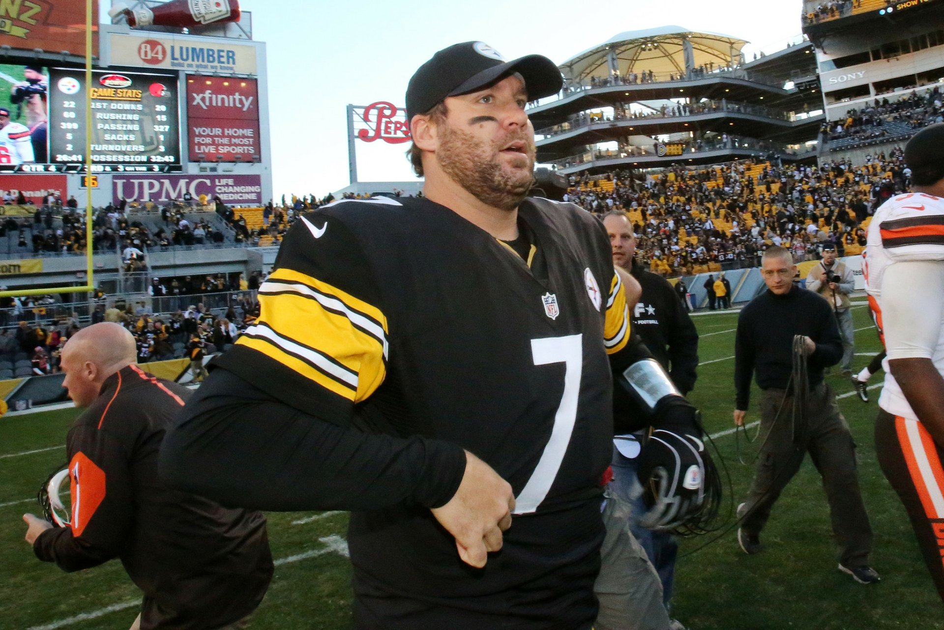 HD PC desktop wallpaper featuring a Pittsburgh Steelers player on the field during a game, showcasing team colors and stadium atmosphere.