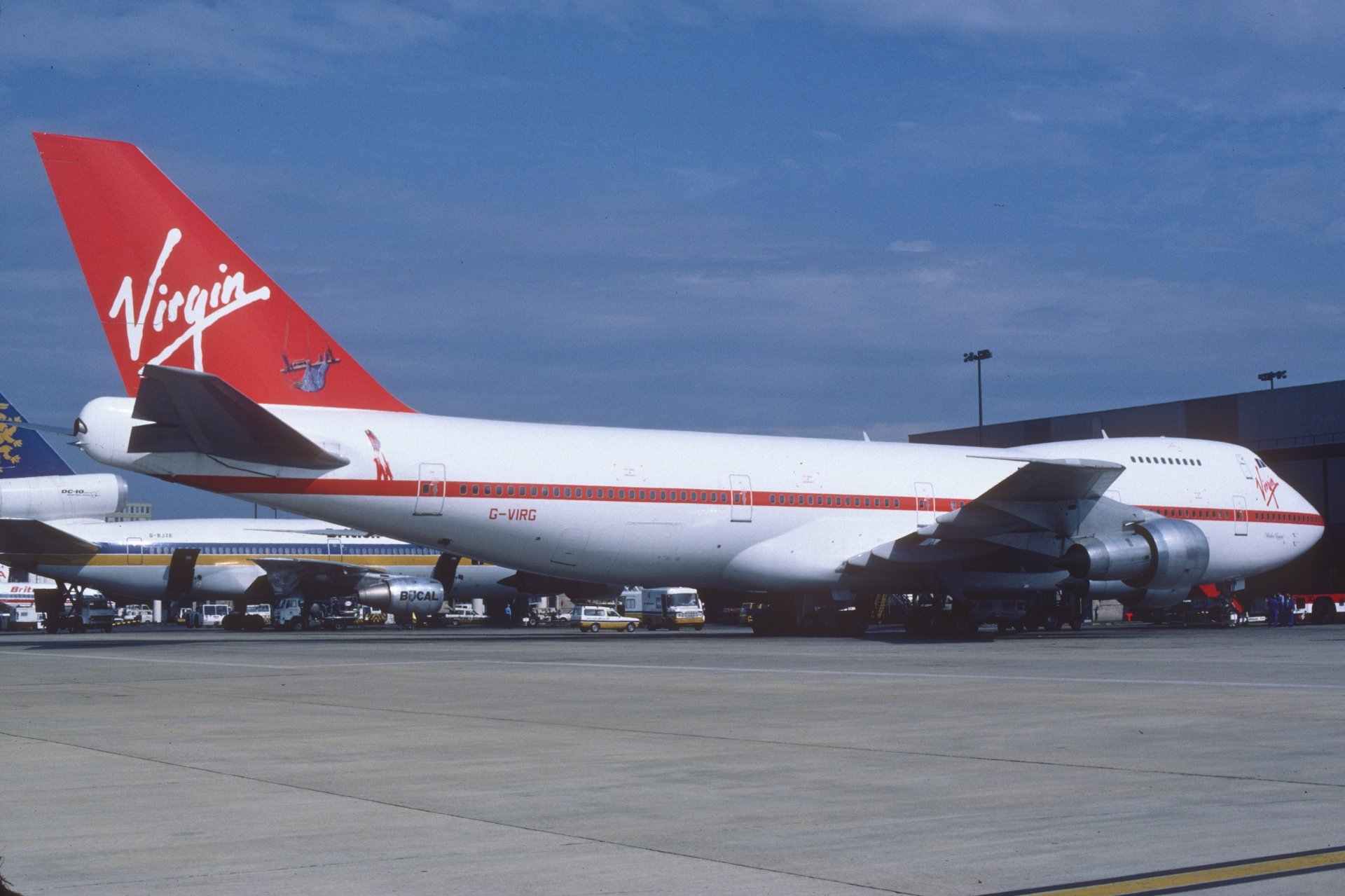 A Virgin Boeing 747 aircraft parked on the tarmac, captured in 8K Ultra HD quality as a PC desktop wallpaper and background.