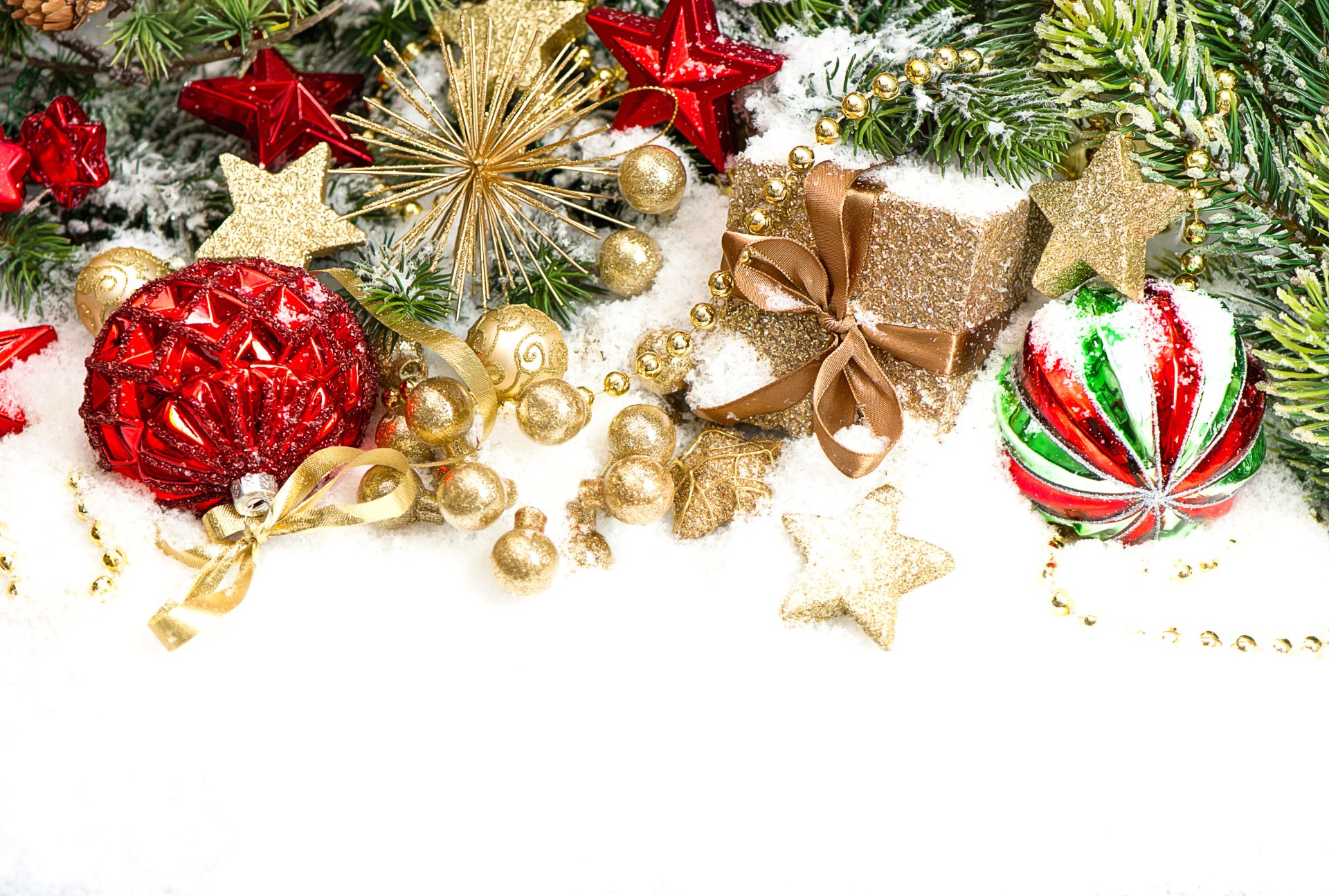 A vibrant 4K Ultra HD Christmas desktop wallpaper featuring festive holiday ornaments, including red and gold baubles, stars, ribbons, and a wrapped gift on evergreen branches.