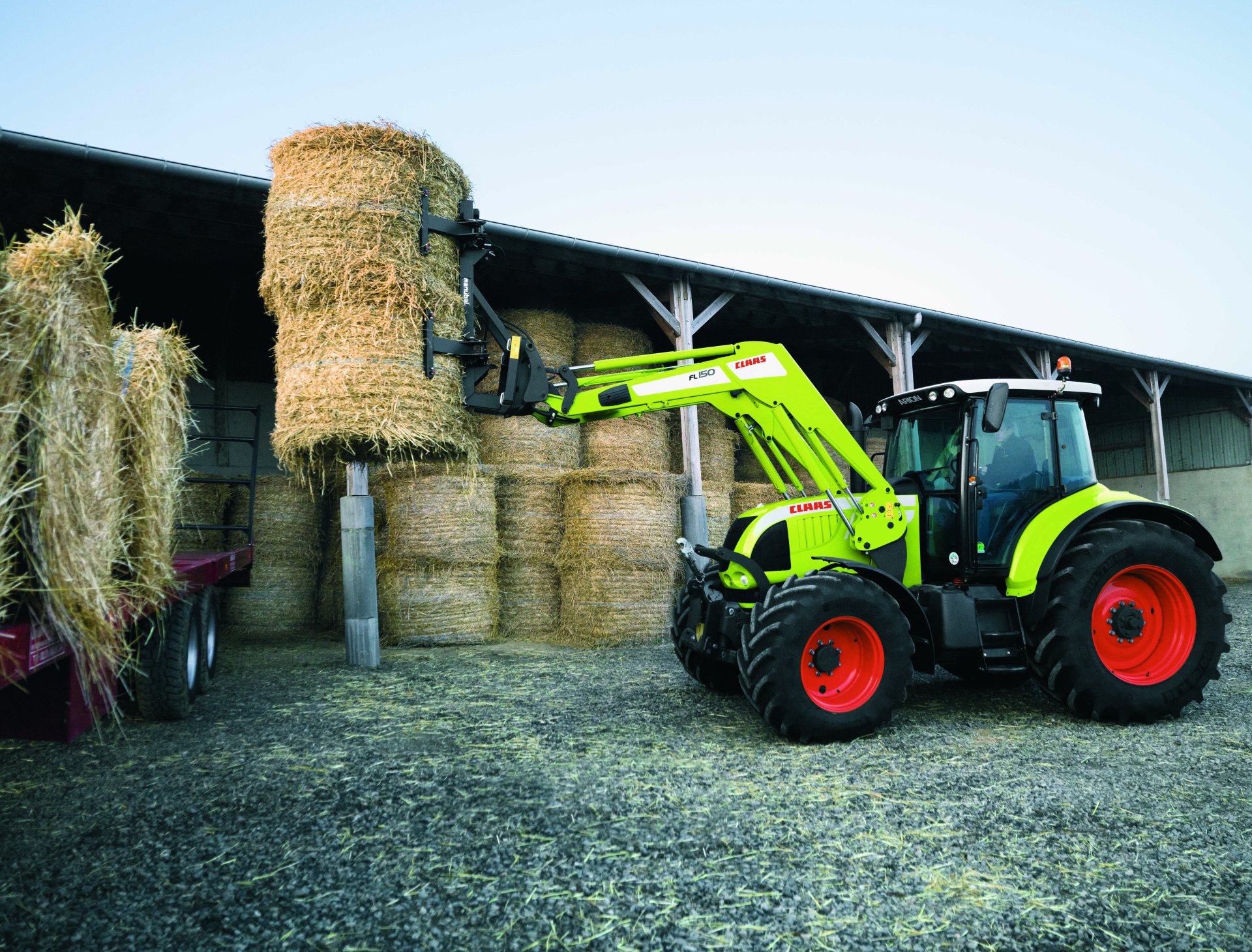 A Claas vehicle lifting hay bales near a barn, captured in 8K Ultra HD as a detailed PC desktop wallpaper and background.