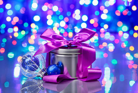 A festive Christmas scene featuring a decorated gift tin with a purple ribbon, surrounded by colorful bokeh lights and sparkling ornaments, creating a joyful holiday atmosphere.