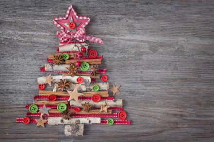 A decorative Christmas tree made of various materials and festive accents, set against a rustic wood background. This 4K Ultra HD wallpaper captures the essence of the holiday spirit.