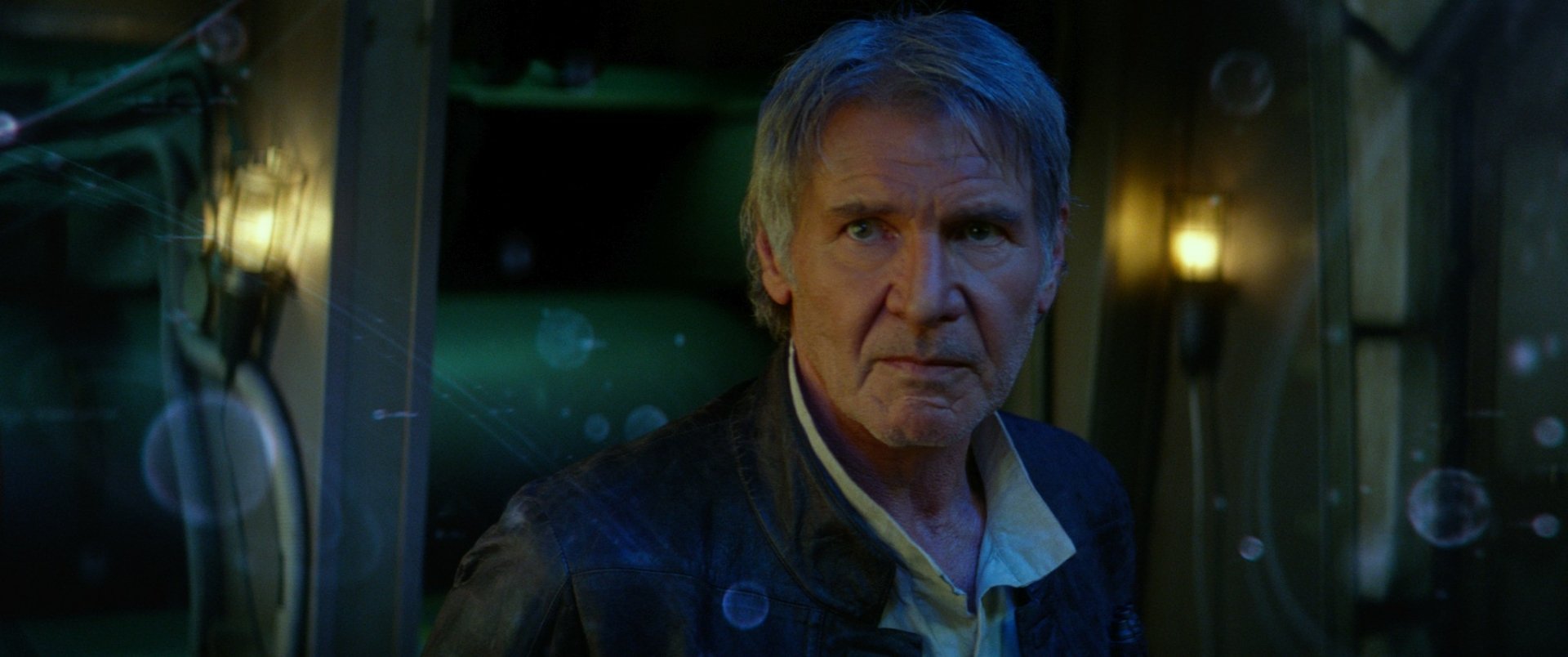 Han Solo, portrayed by Harrison Ford, stands in a dramatic moment from Star Wars Episode VII: The Force Awakens, set against a captivating HD backdrop.