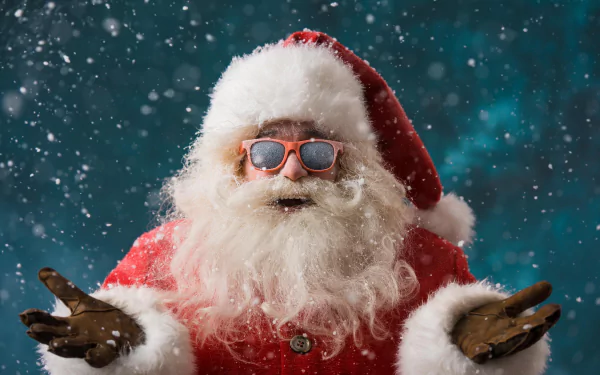 A cheerful Santa in sunglasses spreads holiday joy amidst falling snow, capturing the spirit of Christmas in this vibrant HD desktop wallpaper.