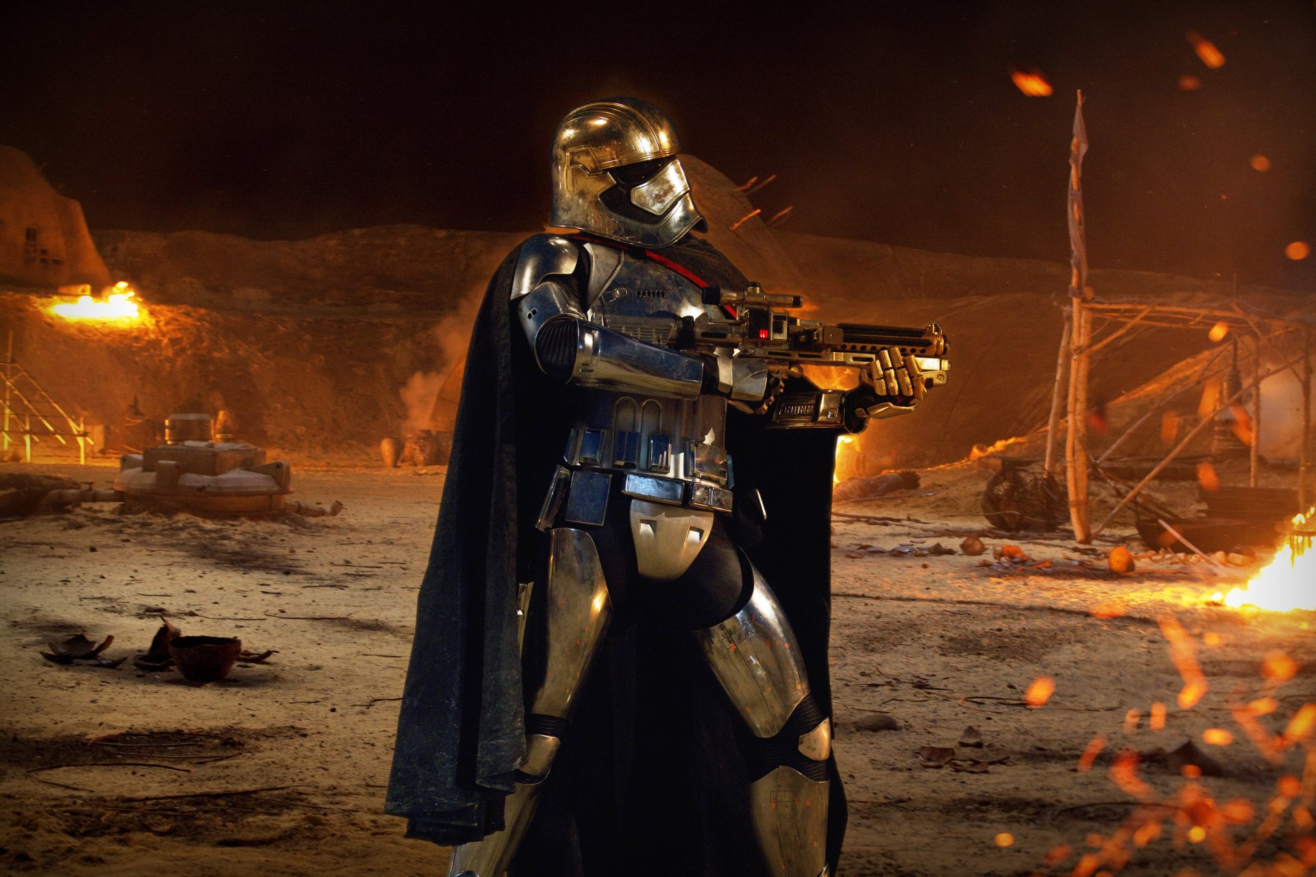 Captain Phasma stands poised with a blaster in a fiery landscape from Star Wars Episode VII: The Force Awakens, showcasing a stunning 4K Ultra HD visual experience.
