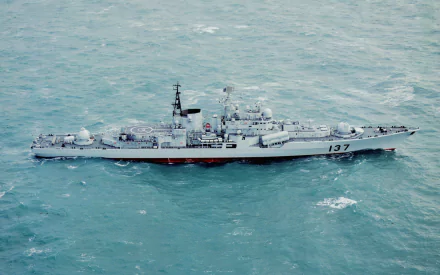 Aerial view of Chinese Navy destroyer Fuzhou (137) cutting through teal sea, a military warship shown as an HD PC desktop wallpaper/background.