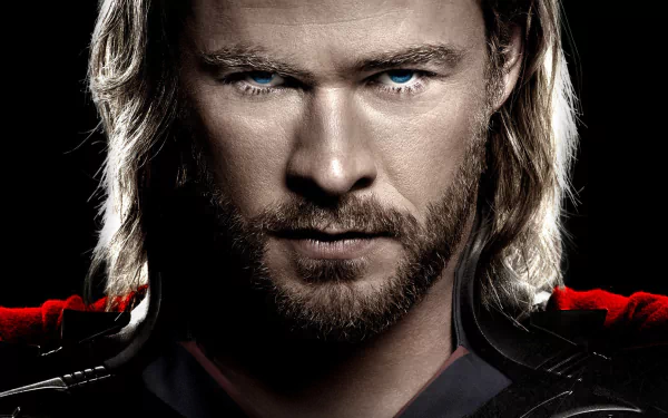 Chris Hemsworth as Thor, showcasing his intense expression and striking features, featured in this HD desktop wallpaper background from the iconic movie.