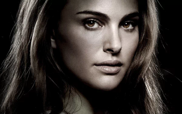 HD desktop wallpaper featuring Jane Foster from the movie Thor, with a close-up of her face and a dark background.