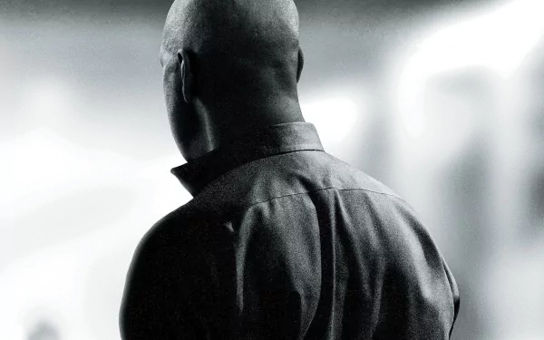 Rear view of a solitary man in a dark coat from The Equalizer movie, high-contrast black-and-white HD PC desktop wallpaper and background.