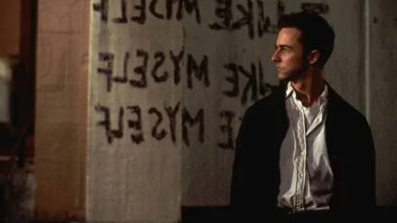 HD PC desktop wallpaper: brooding man in a white shirt and dark coat stands before a spray-painted message on a grim wall in a gritty scene from the movie Fight Club.