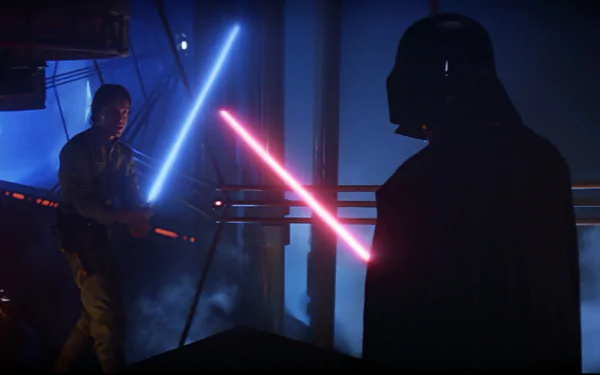A dramatic scene from Star Wars Episode V: The Empire Strikes Back, featuring Luke Skywalker wielding a blue lightsaber against Darth Vader's red lightsaber, set in a dark environment.