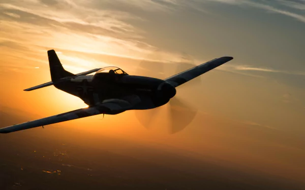 A North American P-51 Mustang warplane aircraft flies against a vibrant sunset sky, captured in stunning 4K Ultra HD detail.
