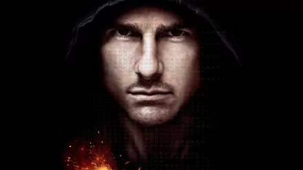 HD PC desktop wallpaper featuring a close-up of Tom Cruise from the movie Mission: Impossible - Ghost Protocol with a dark, intense background and fiery effects.