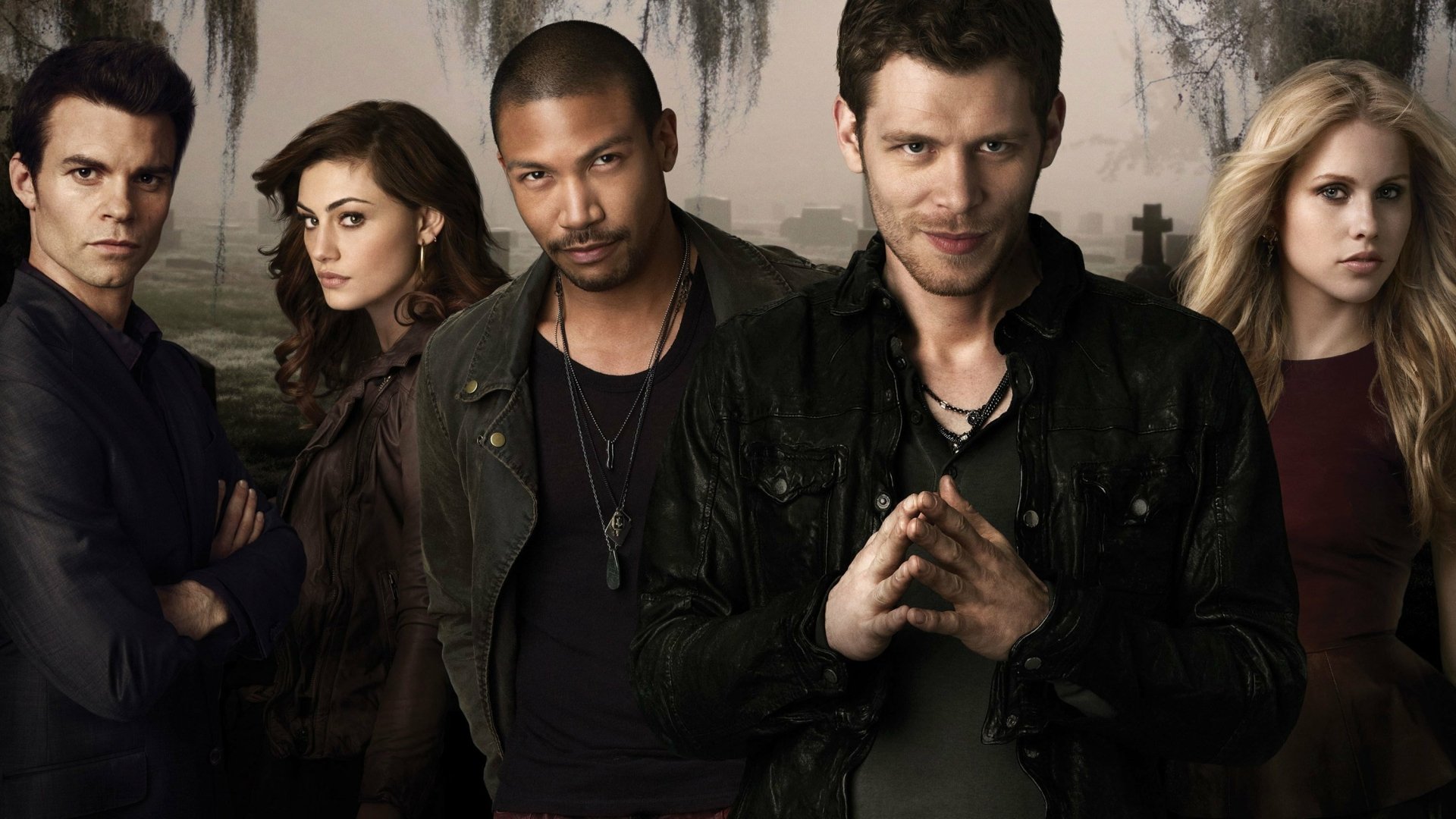 HD desktop wallpaper featuring characters from the TV show The Originals, set against a dark, atmospheric background with a graveyard theme.