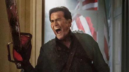 HD desktop wallpaper featuring a dramatic scene from the TV show Ash vs. Evil Dead, showing the protagonist wielding a chainsaw with intense expression.