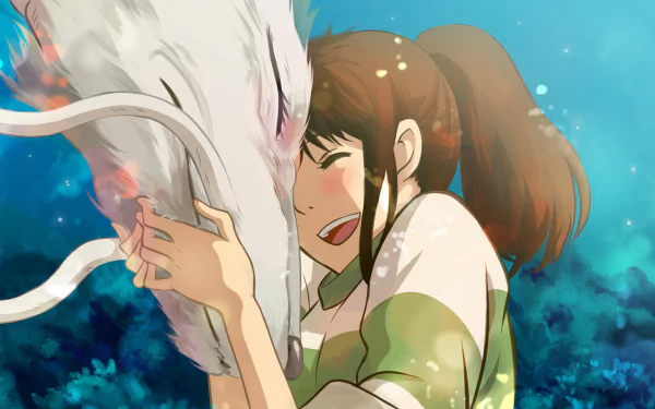 A vibrant HD desktop wallpaper featuring an emotional moment from the anime Spirited Away, showcasing a girl joyfully embracing a white dragon against a magical, colorful background.