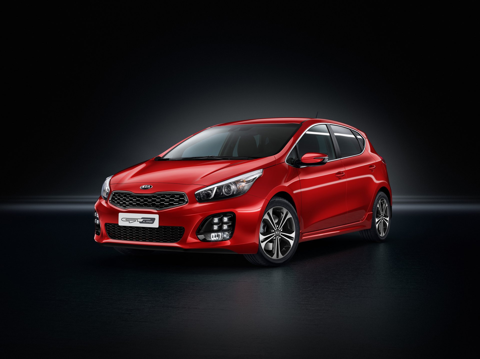 Red Kia Ceed hatchback in studio lighting with glossy reflections, high-detail 4K Ultra HD PC desktop wallpaper background