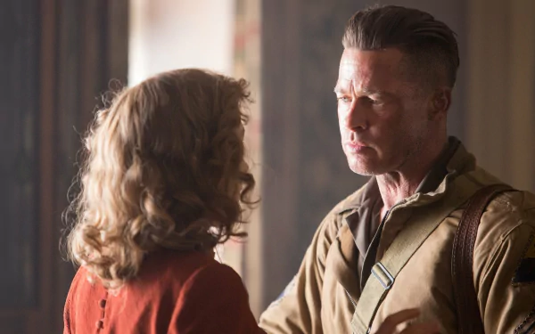 A dramatic scene from the movie Fury, featuring Brad Pitt in a tense moment. This HD wallpaper captures the emotional intensity of the film's narrative.