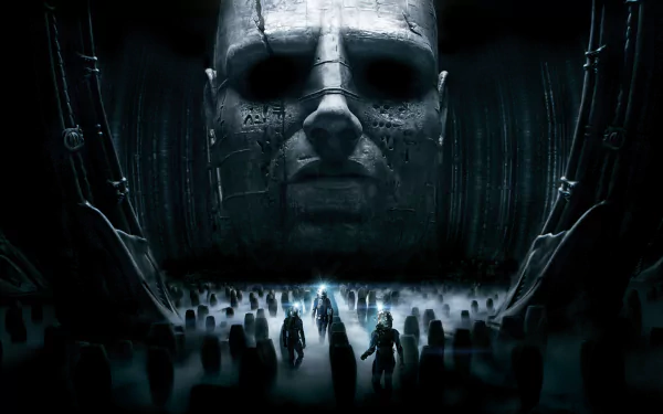 HD PC desktop wallpaper featuring a dark, ominous scene from the movie Prometheus with a giant stone head and silhouetted figures in a mysterious landscape.