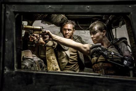 A thrilling scene from *Mad Max: Fury Road* featuring Imperator Furiosa (Charlize Theron) and Max (Tom Hardy) as they confront danger from within a vehicle.