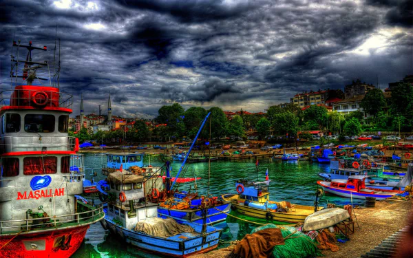 A vibrant marina in Turkey, showcasing colorful boats docked by lush trees under dramatic clouds. This HDR photography captures the serene yet lively atmosphere of the harbor.