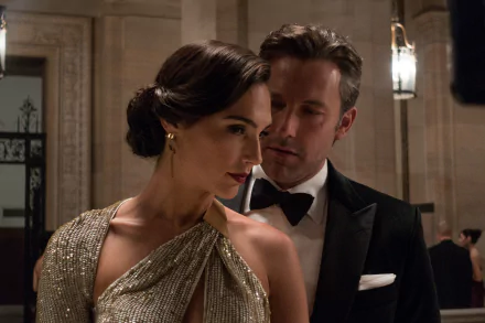Gal Gadot as Diana Prince and Ben Affleck as Bruce Wayne share a moment in a scene from the movie Batman V Superman: Dawn of Justice. This HD desktop wallpaper captures the elegance and intensity of the film.