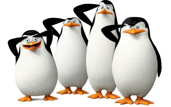 A colorful HD desktop wallpaper featuring the four penguins from Penguins Of Madagascar, playfully saluting with distinct expressions and striking poses.