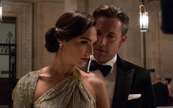 Gal Gadot as Diana Prince and Ben Affleck as Bruce Wayne share a moment in a scene from the movie Batman V Superman: Dawn of Justice. This HD desktop wallpaper captures the elegance and intensity of the film.