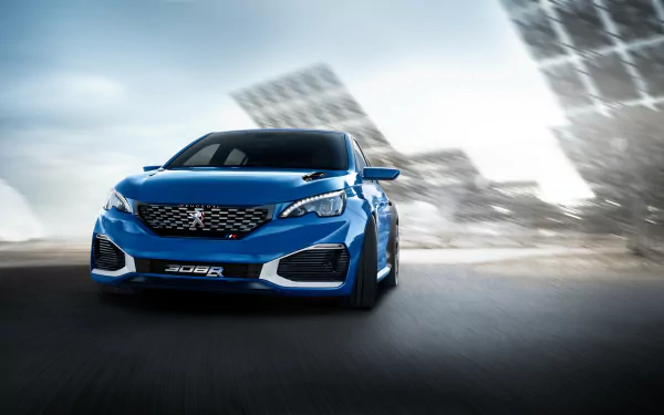 Blue Peugeot 308 R compact car charging toward the viewer against a blurred urban backdrop — 4K Ultra HD PC desktop wallpaper and background.