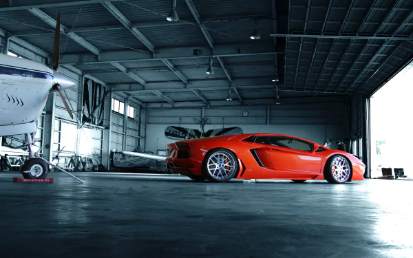 Red Lamborghini Aventador LP 700-4 parked in a hangar beside a private plane — 4K Ultra HD PC desktop wallpaper featuring a sleek vehicle.