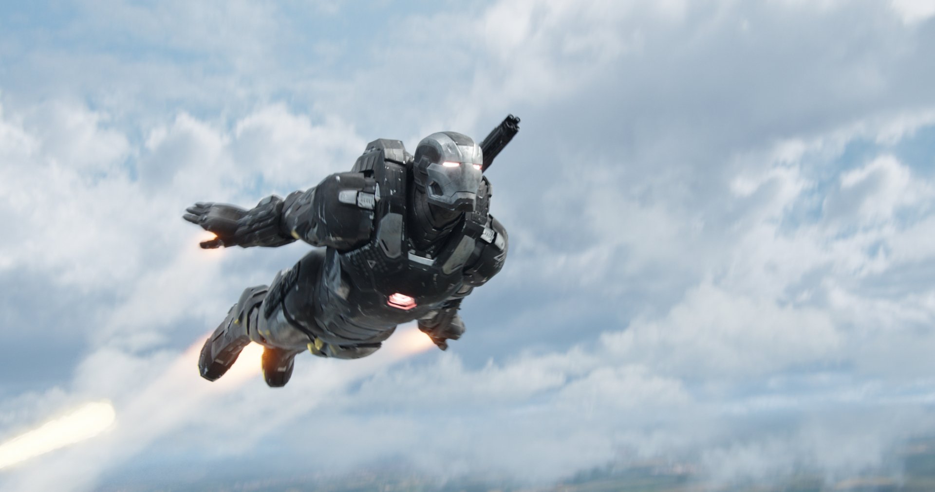 War Machine soars through a dynamic sky in this HD desktop wallpaper from Captain America: Civil War, showcasing powerful flying action and cinematic intensity.