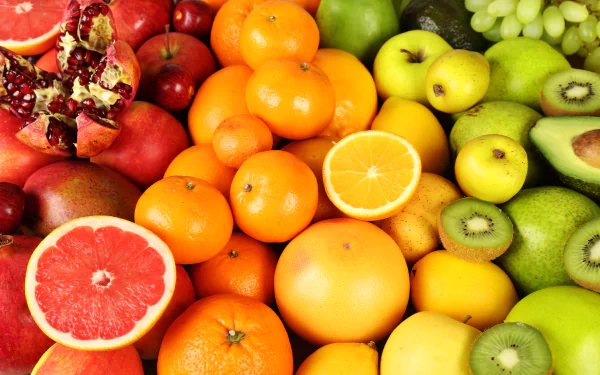Colorful 5K Ultra HD PC desktop wallpaper of assorted fruit: apples, grapefruit, oranges, kiwis and grapes arranged in a vivid food background.