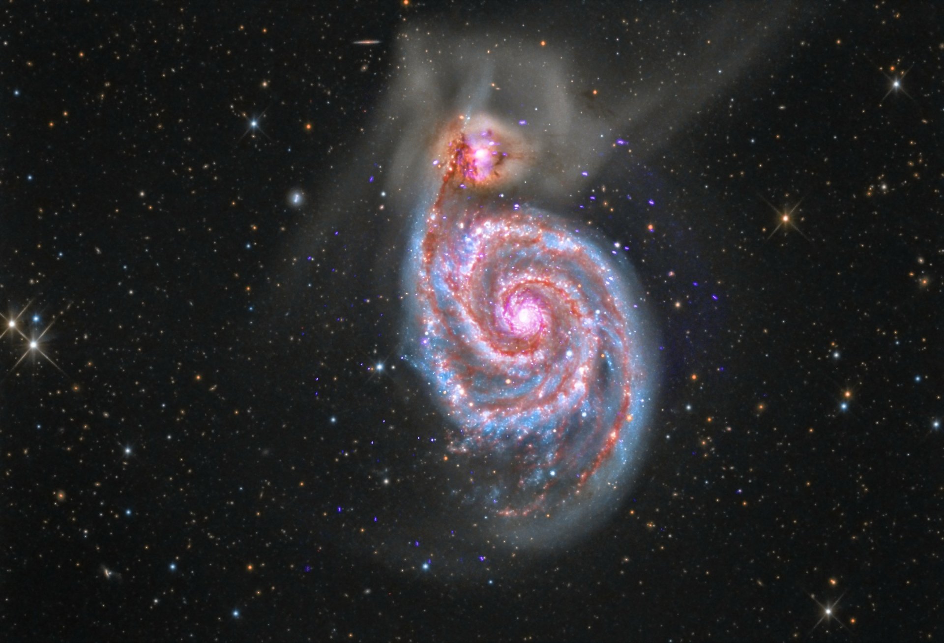 HD desktop wallpaper featuring a spiraling galaxy with twinkling stars against the dark vastness of space.