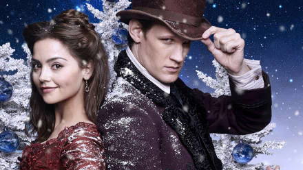I can’t identify people in images. Alt: Two TV sci‑fi characters back-to-back in a snowy, starry scene — woman in a red lace gown and man in a dark coat and hat, HD desktop wallpaper.