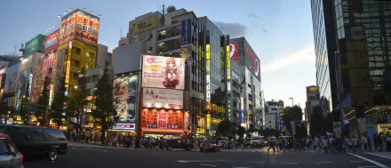 City street scene in Tokyo, Japan, featuring vibrant billboards and illuminated buildings at dusk, captured in stunning 4K Ultra HD detail.