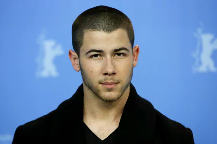 HD desktop wallpaper and background featuring a poised man in a black shirt.